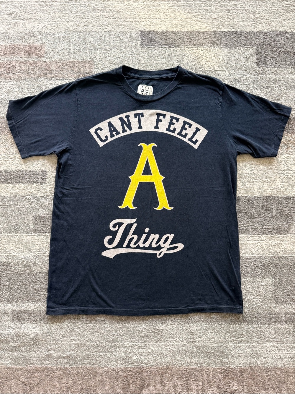 Can't Feel A Thing Graphic Tee - Black with Yellow Accent